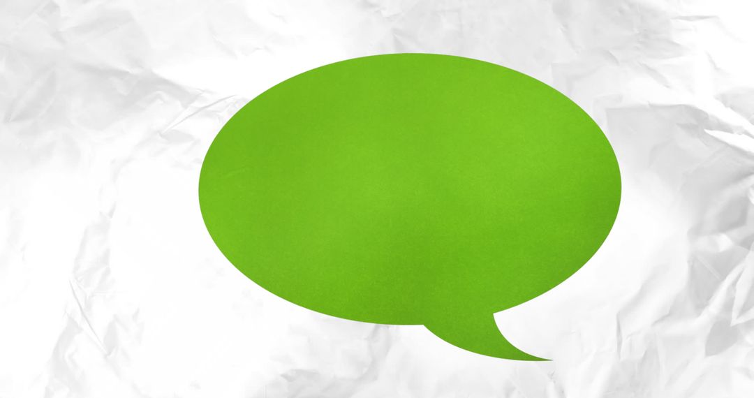 Green Speech Bubble on Textured White Background for Communication Concept