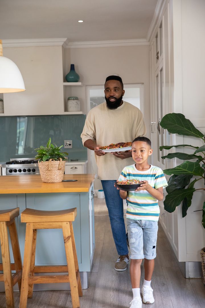 Father and Son in Kitchen Enjoying Quality Time
