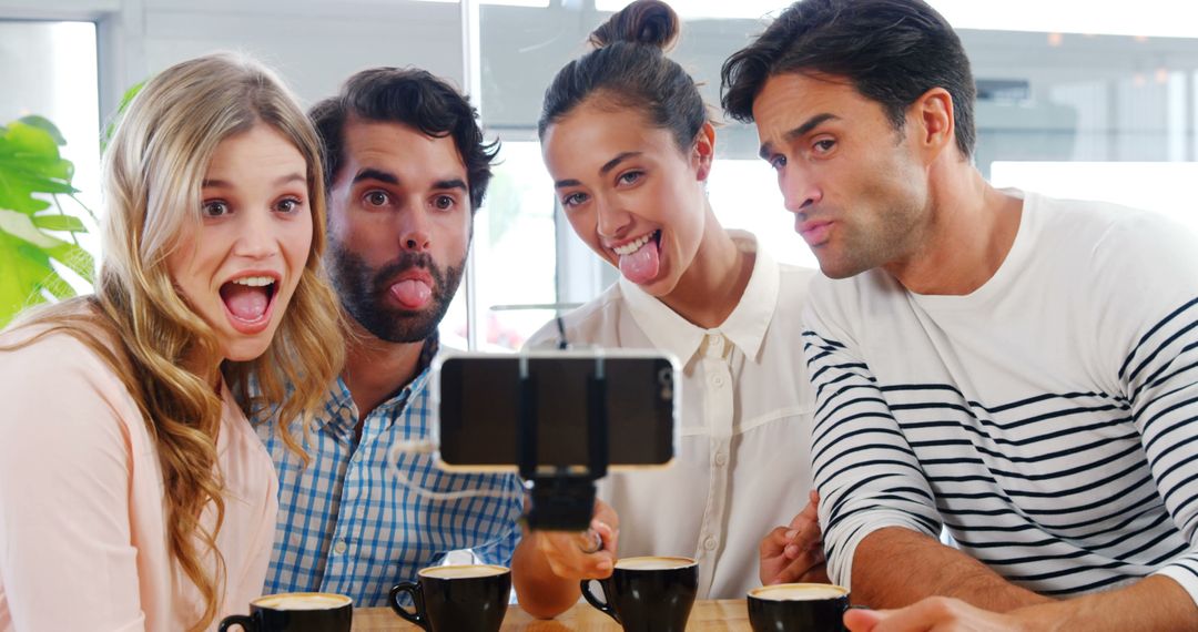 Friends Taking Selfie in Coffee Shop Making Funny Faces - Free Images, Stock Photos and Pictures on Pikwizard.com