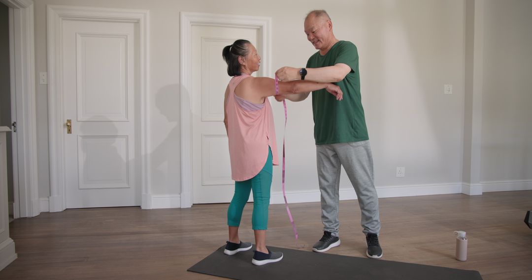 Senior Couple Enjoying Home Workout Routine