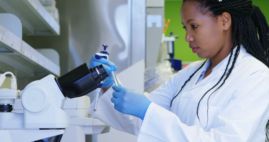 Female Scientist Working with Microscope in Laboratory - Free Images, Stock Photos and Pictures on Pikwizard.com