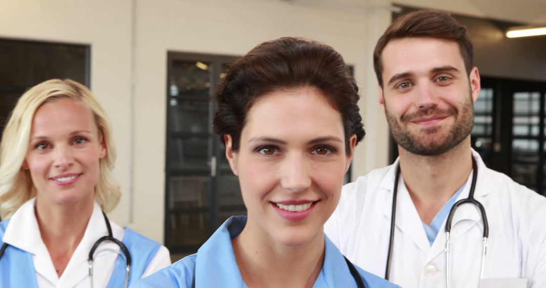 Group of Smiling Healthcare Professionals in Medical Uniforms - Free Images, Stock Photos and Pictures on Pikwizard.com