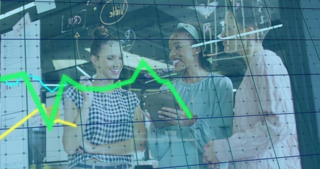 Diverse Female Colleagues Analyzing Data on Digital Interface