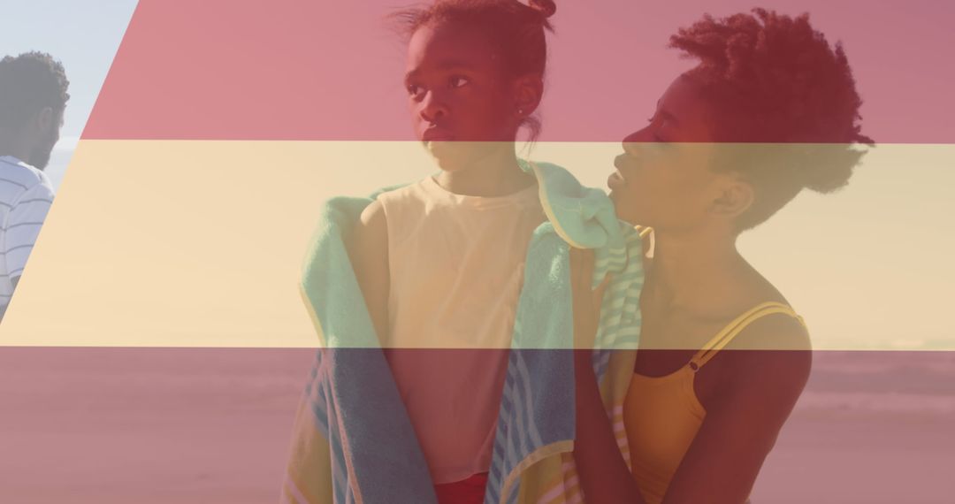 Family Enjoying Day at Sunny Beach with Towels and Warm Smiles
