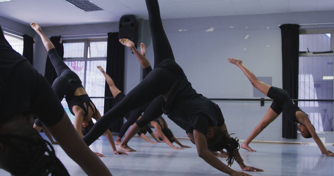 Group of Dancers Practicing Contemporary Dance Routine - Free Images, Stock Photos and Pictures on Pikwizard.com