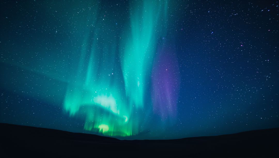 Aurora Borealis Shimmering Over Remote Plain with Starlit Night