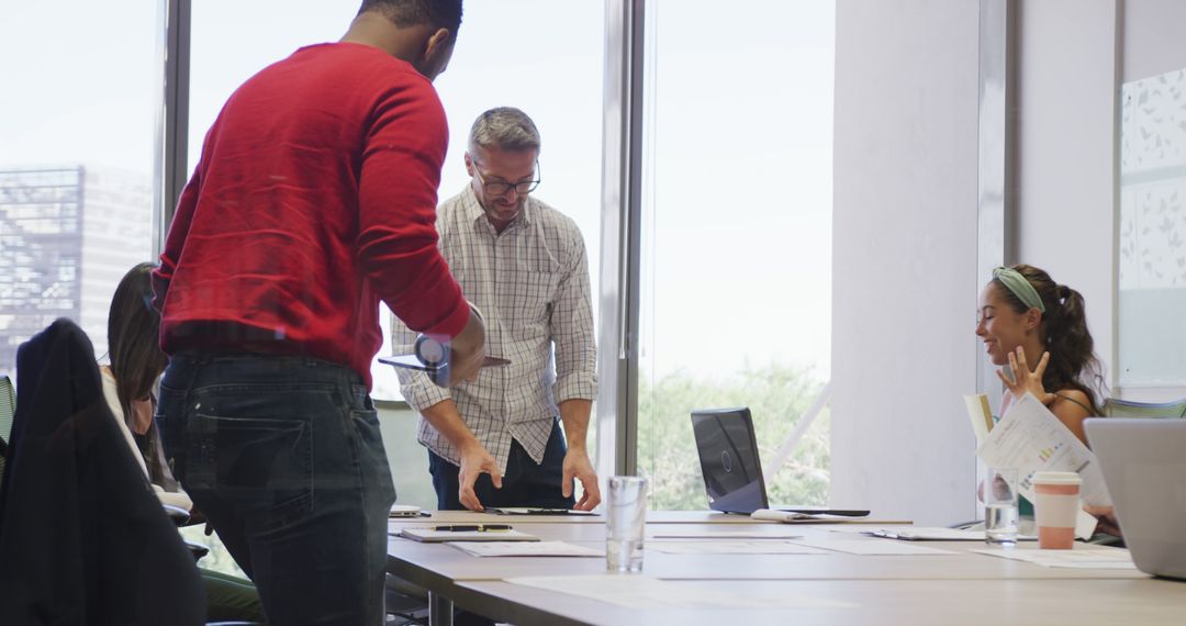 Team Meeting Discussion in Modern Office Environment