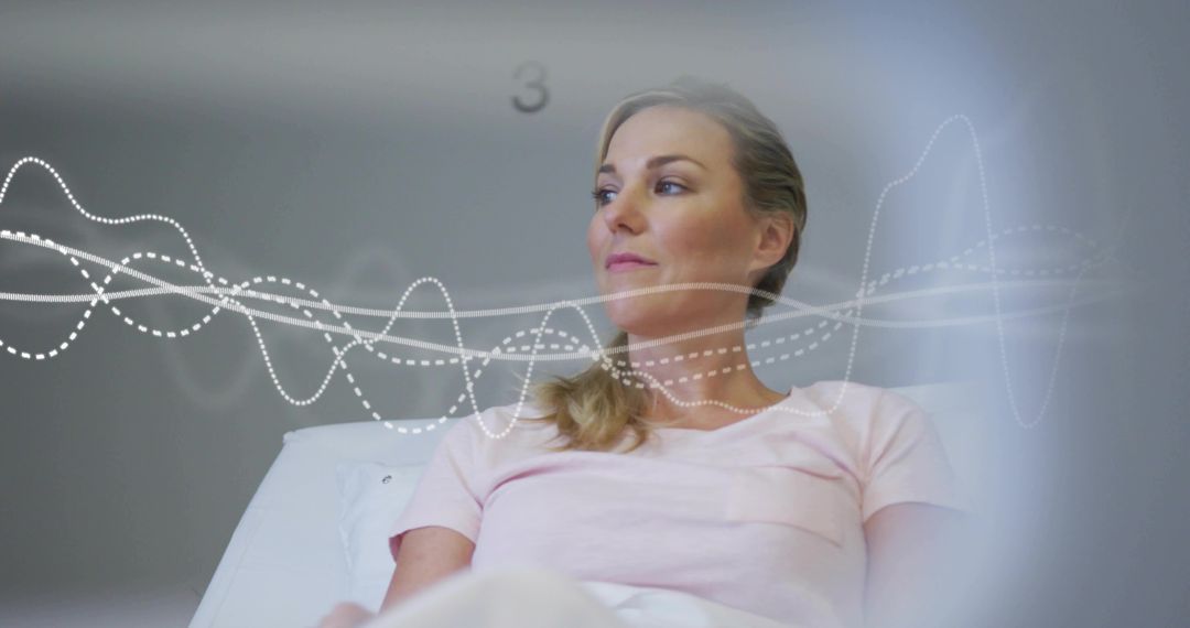 Reclining woman on exam table with diagnostic waveform overlay representing patient monitoring