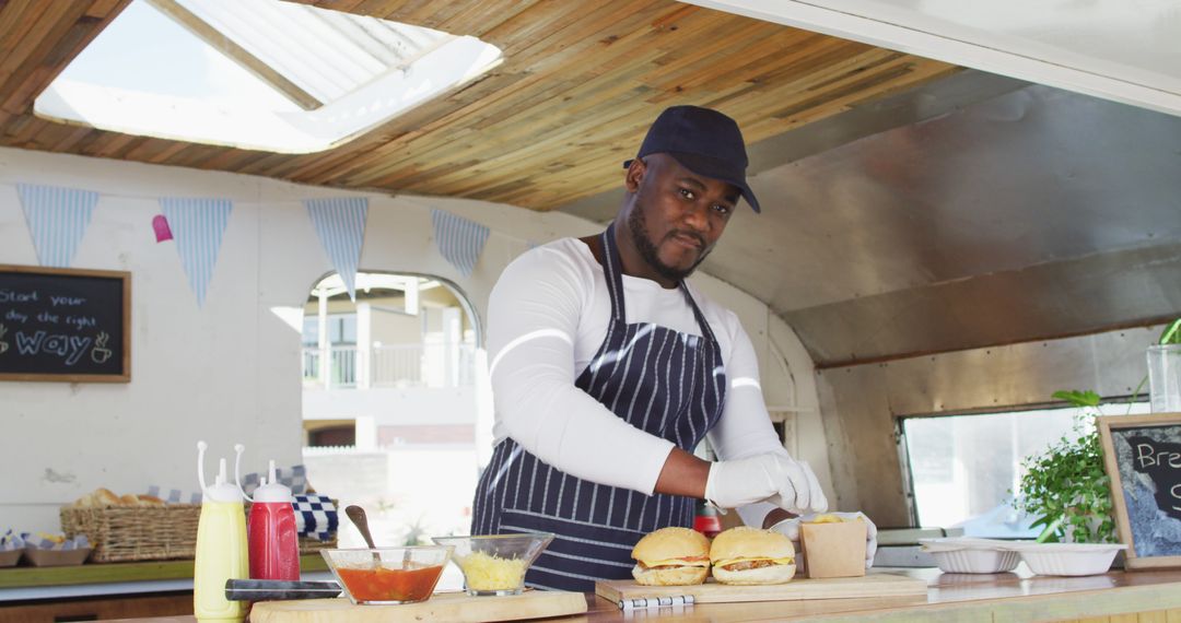 African American Chef Preparing Food in Food Truck - Free Images, Stock Photos and Pictures on Pikwizard.com