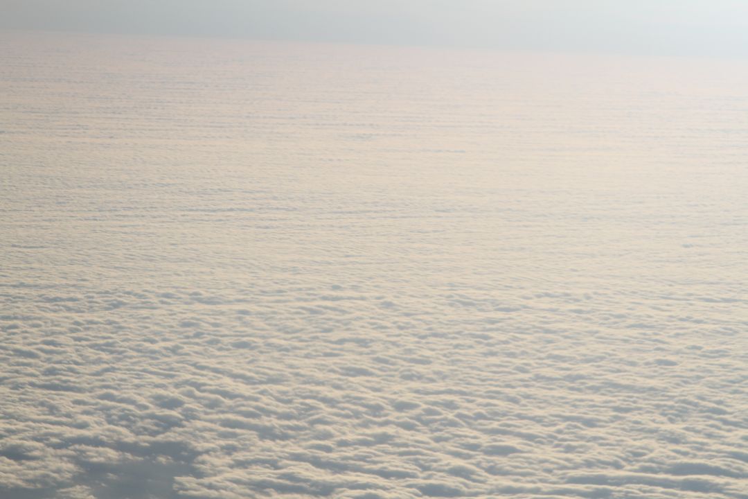 Aerial View of Dense Cloud Cover with Soft Sunset Light - Free Images, Stock Photos and Pictures on Pikwizard.com