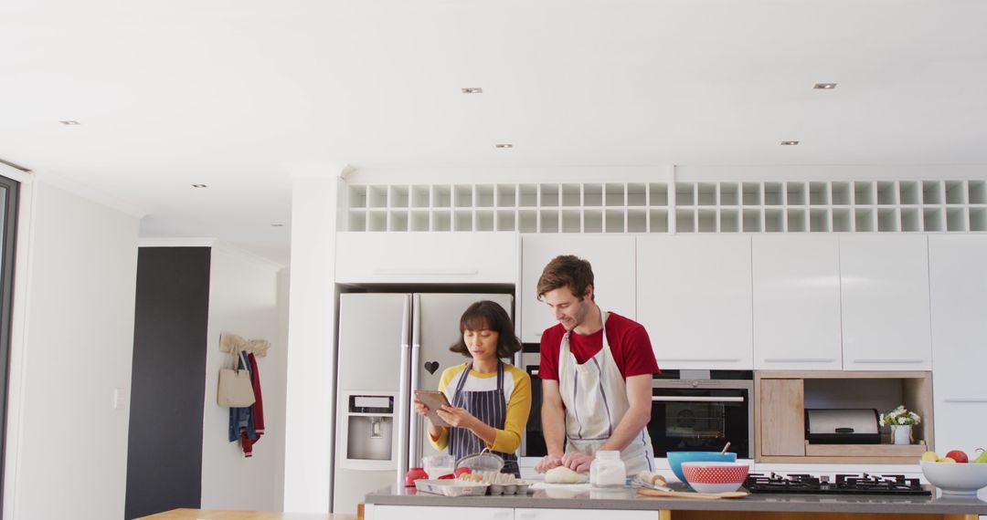 Couple Preparing Food in Modern Kitchen - Free Images, Stock Photos and Pictures on Pikwizard.com