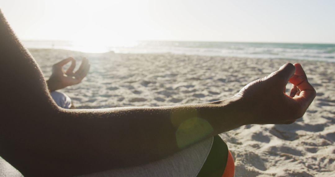 Man Meditating on Beach with Sunset in Background - Free Images, Stock Photos and Pictures on Pikwizard.com