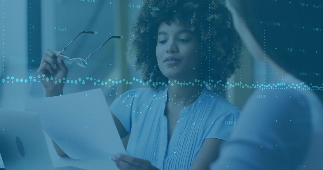 Discussing Financial Data in Modern Office Setting