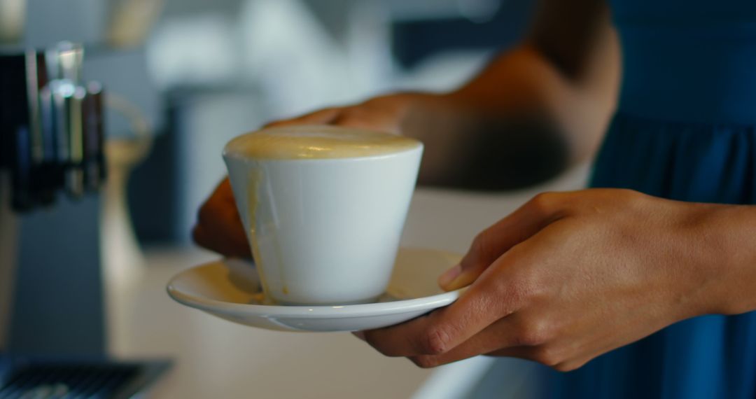 Hands Holding Freshly Made Cappuccino in White Cup - Free Images, Stock Photos and Pictures on Pikwizard.com