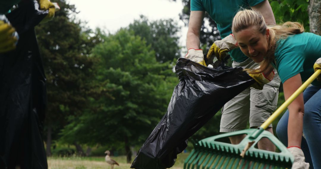 Volunteers Collecting Trash Outdoors in Park - Free Images, Stock Photos and Pictures on Pikwizard.com