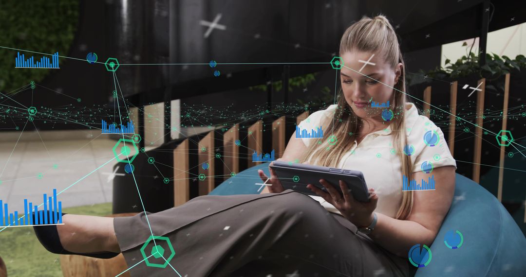 Woman Analyzing Holographic Data on Tablet at Modern Workspace