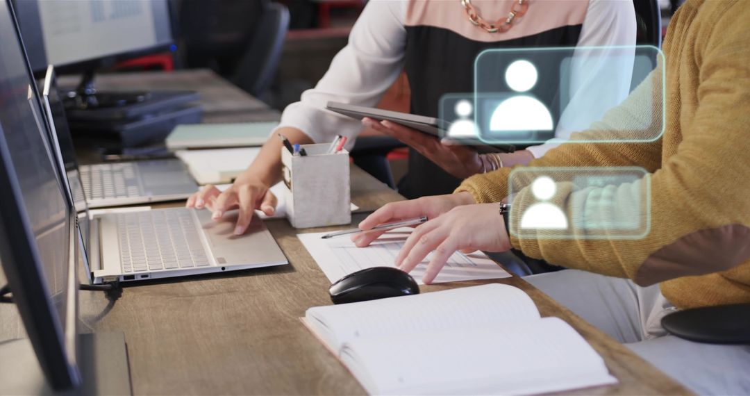 Diverse Colleagues Using Laptops in Modern Office Environment