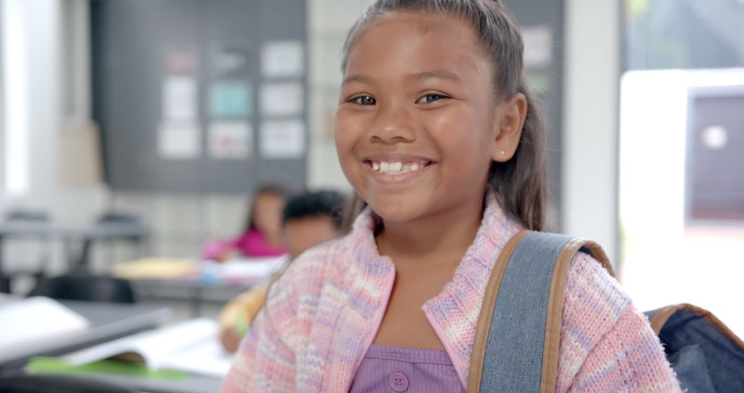 Smiling Schoolgirl with Backpack in Classroom, Ready for New Day