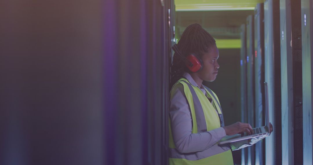 Focused Engineer Working in Server Room