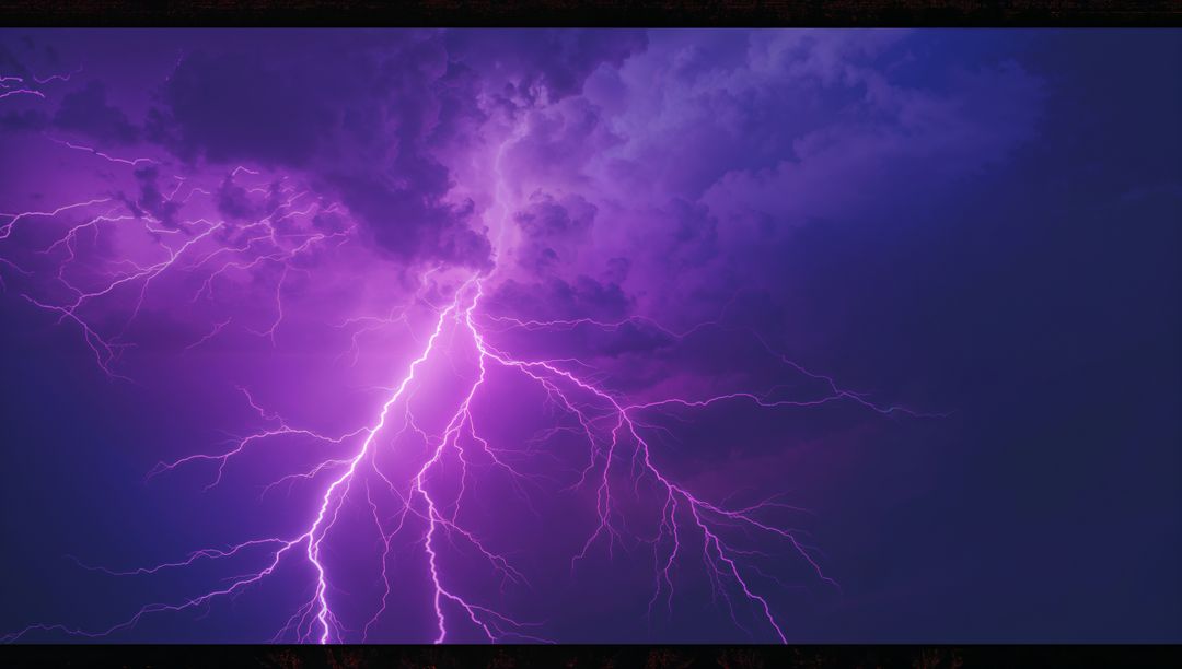 Dramatic Purple Lightning Splitting Sky in Night Thunderstorm
