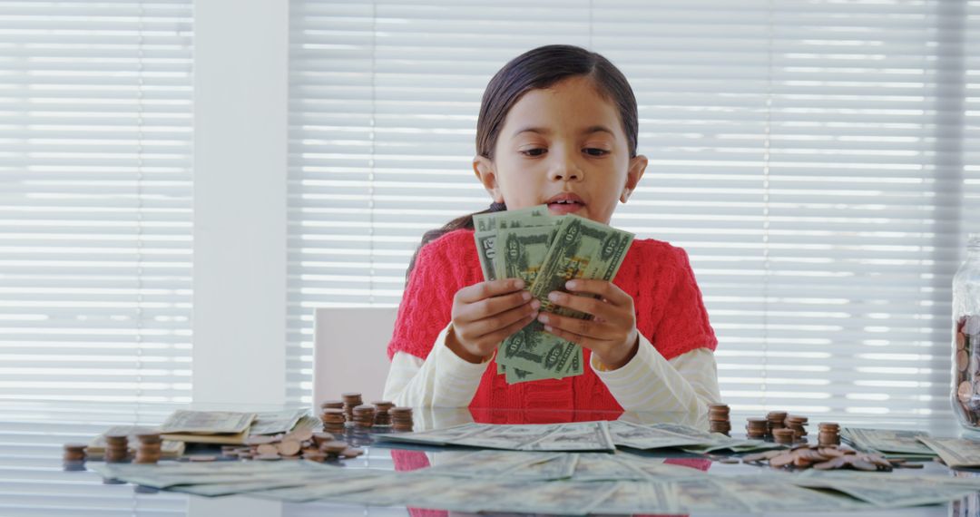 Young Girl Counting Money in Office Setting - Free Images, Stock Photos and Pictures on Pikwizard.com