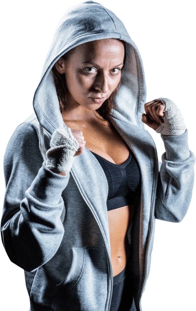 Strong Determined Female Boxer in Gray Hoodie Staring with Focus