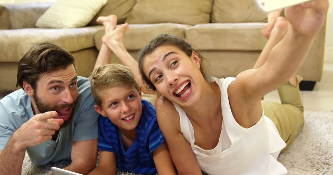 Happy Family Taking Selfie on Living Room Floor - Free Images, Stock Photos and Pictures on Pikwizard.com