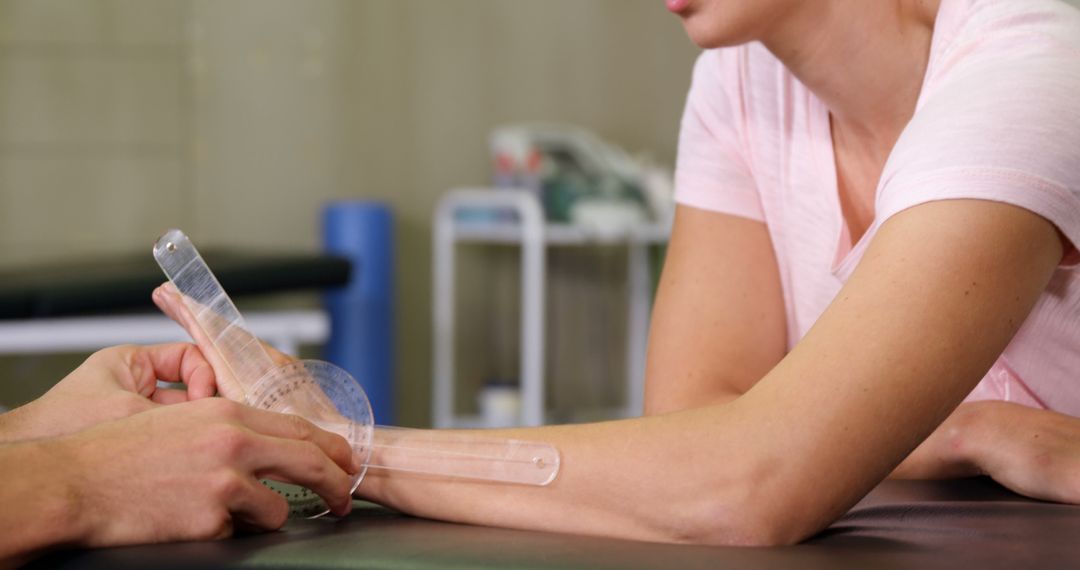 Physical Therapist Measuring Range of Motion in Woman's Elbow - Free Images, Stock Photos and Pictures on Pikwizard.com