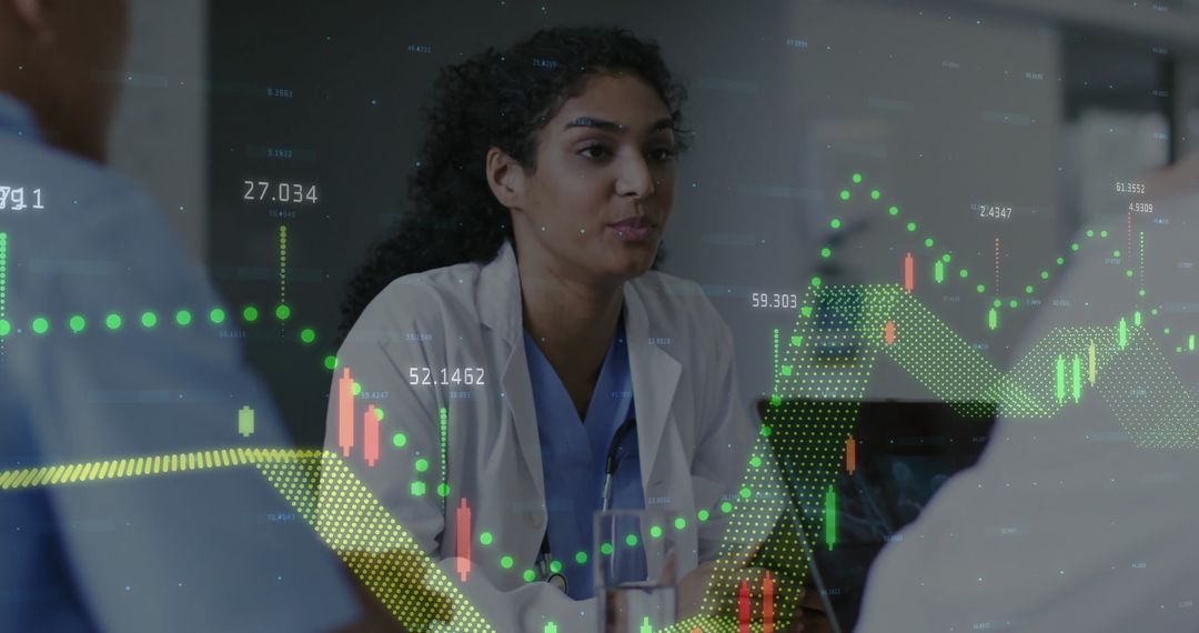 Healthcare Professional Analyzing Graph with Team for Data-Driven Decisions