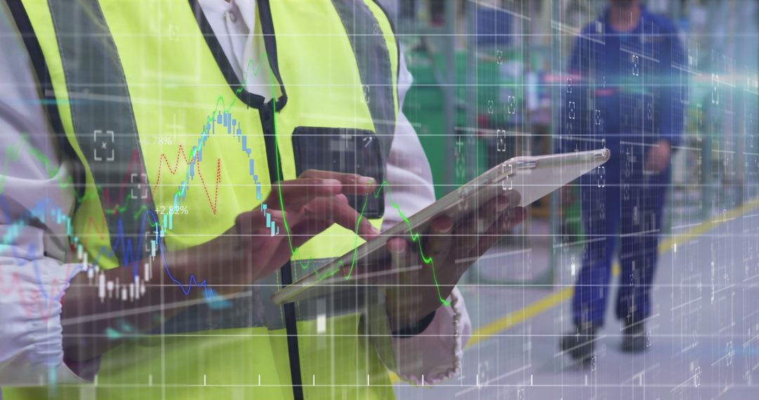 Warehouse Worker Analyzing Digital Financial Data on Tablet