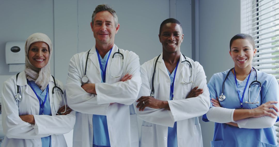 Confident Diverse Medical Team Standing with Arms Crossed in Hospital - Free Images, Stock Photos and Pictures on Pikwizard.com