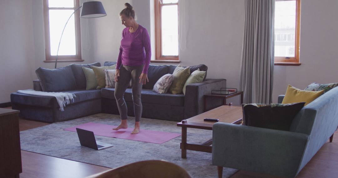 Woman Doing Yoga at Home with Laptop - Free Images, Stock Photos and Pictures on Pikwizard.com