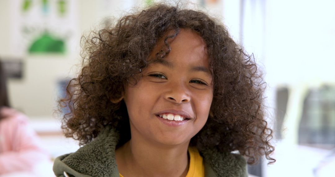 Cheerful School-age Boy Smiling in Classroom Environment