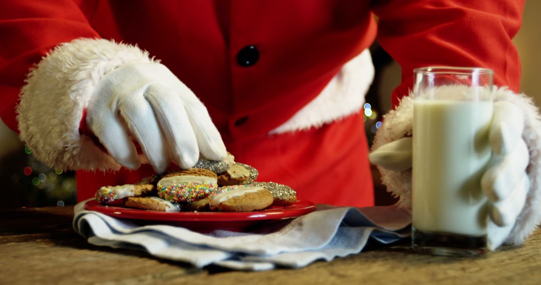 Santa Enjoying Christmas Cookies with Glass of Milk - Free Images, Stock Photos and Pictures on Pikwizard.com