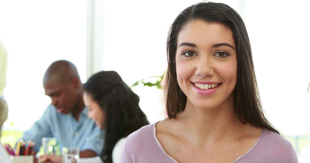 Smiling Female Student in Classroom with Diverse Peers - Free Images, Stock Photos and Pictures on Pikwizard.com