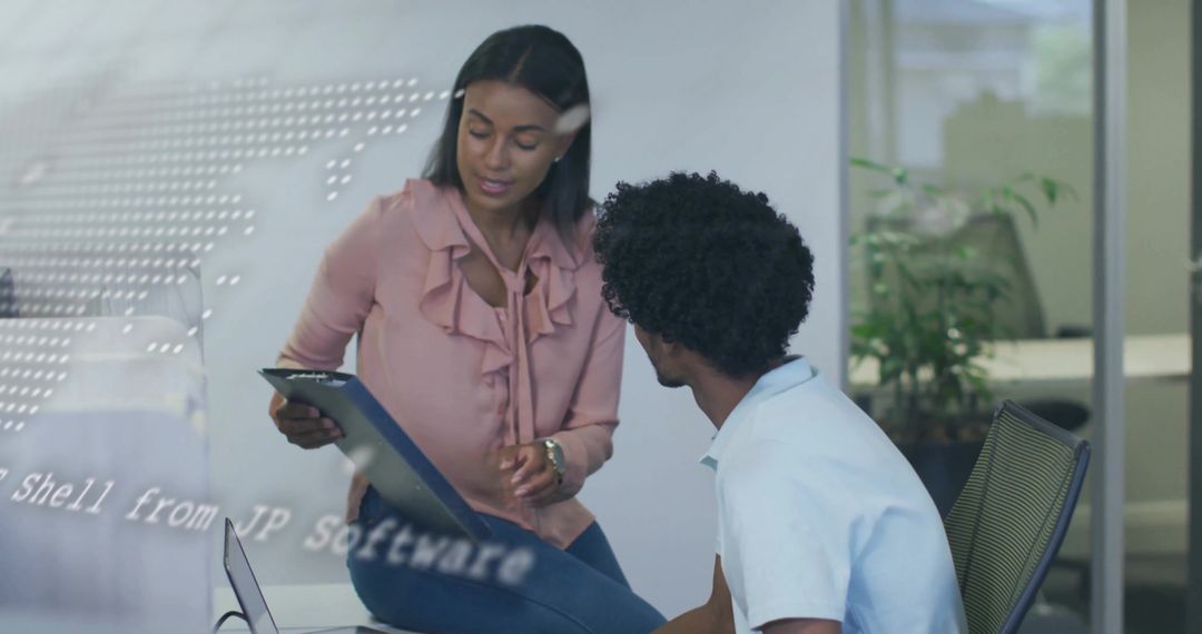 Business Colleagues Collaborating on Digital Tablet in Modern Office