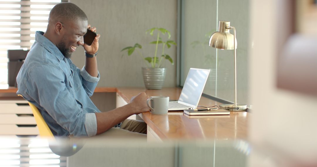 Smiling Professional in Small Office Space Brings Productivity to Mobile Workplace