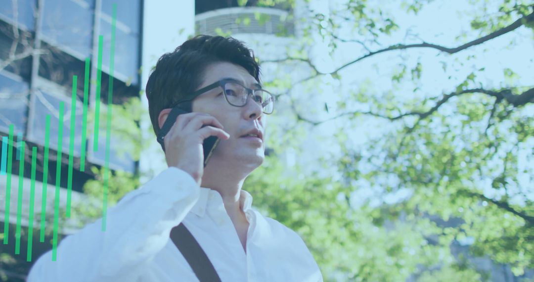 Asian Professional Engaging in Business Call with Growth Graph Overlay