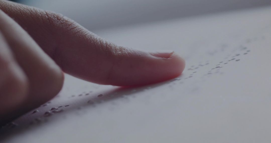 Fingertip Gently Tracing Braille Text, Emphasizes Accessibility