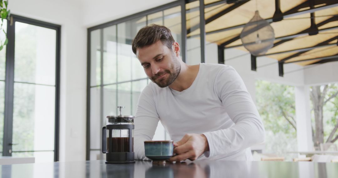 Man Enjoying Freshly Brewed Coffee at Home with French Press - Free Images, Stock Photos and Pictures on Pikwizard.com