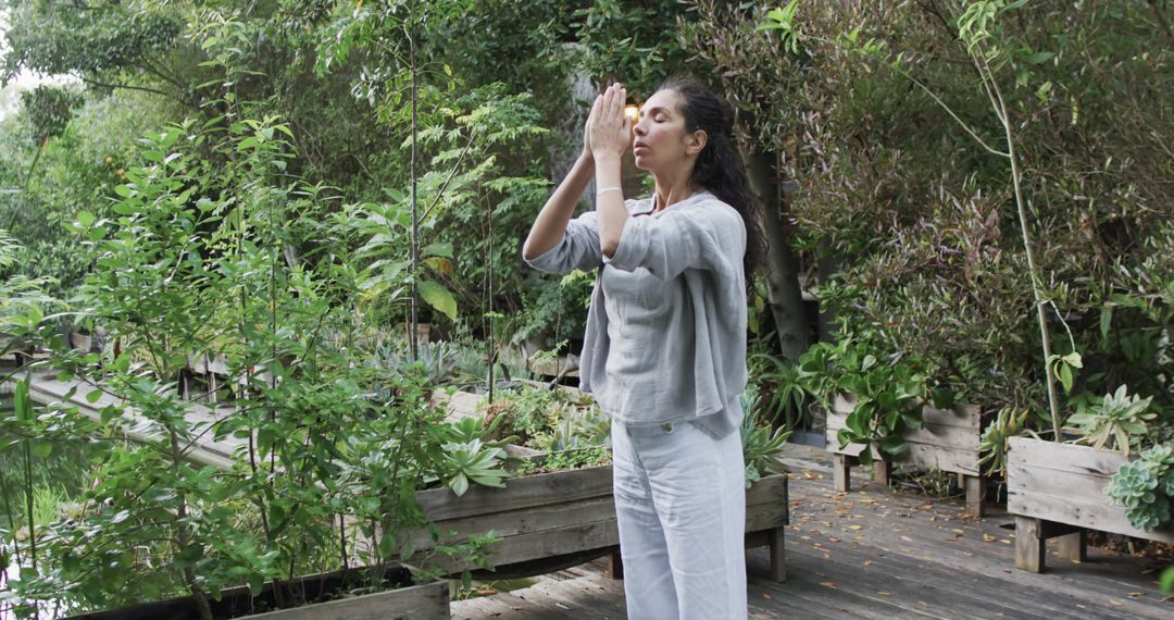 Woman Practicing Mindfulness in Tranquil Garden Setting - Free Images, Stock Photos and Pictures on Pikwizard.com