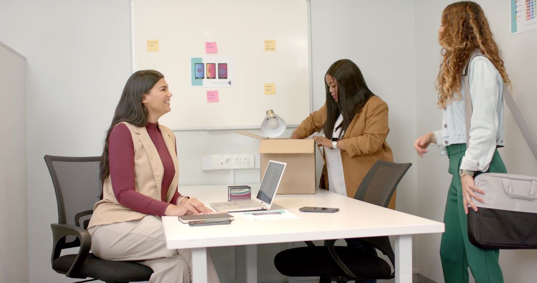 Diverse Female Team Collaborating and Exploring at Office
