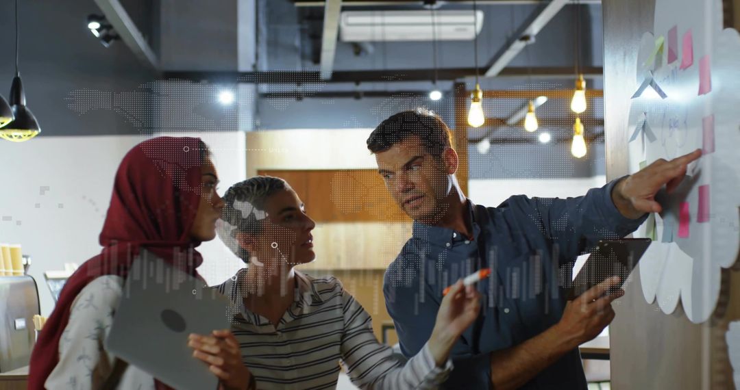 Diverse team collaborating on sticky-note planning in modern coworking office