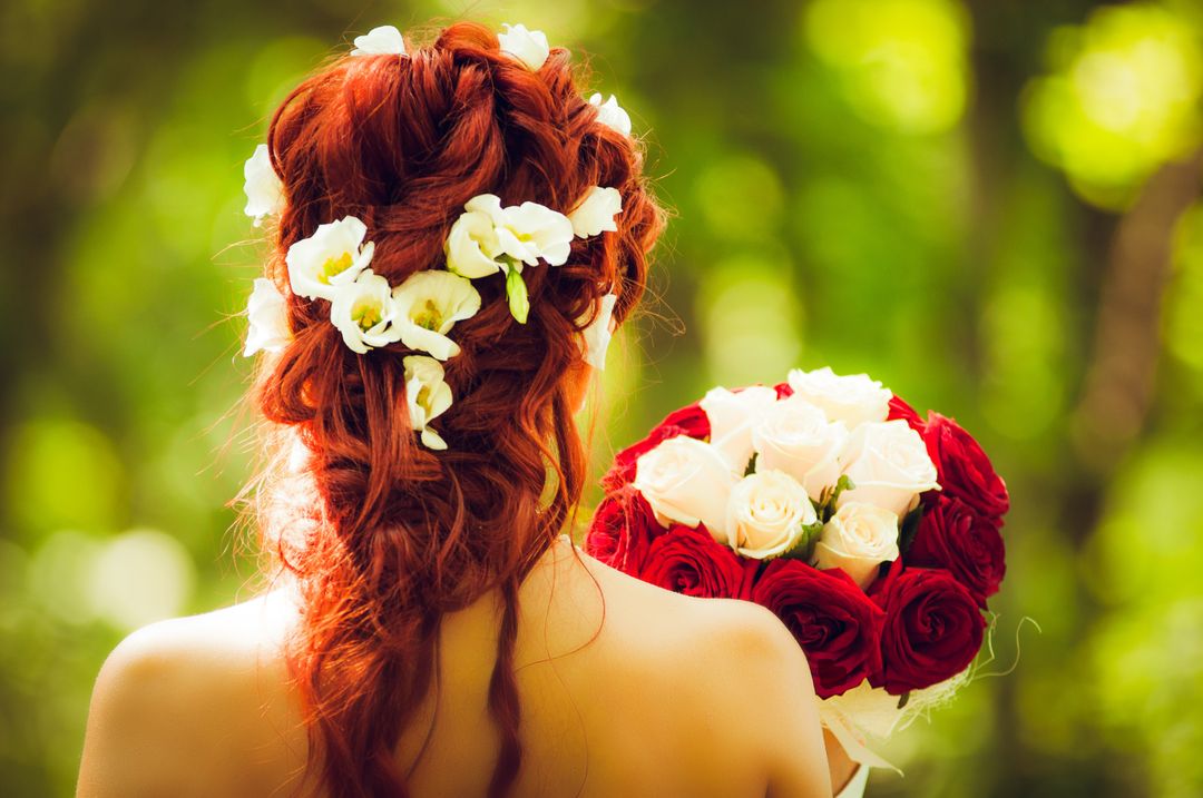 Bride with Red Hair Holding Roses in Outdoor Forest - Free Images, Stock Photos and Pictures on Pikwizard.com