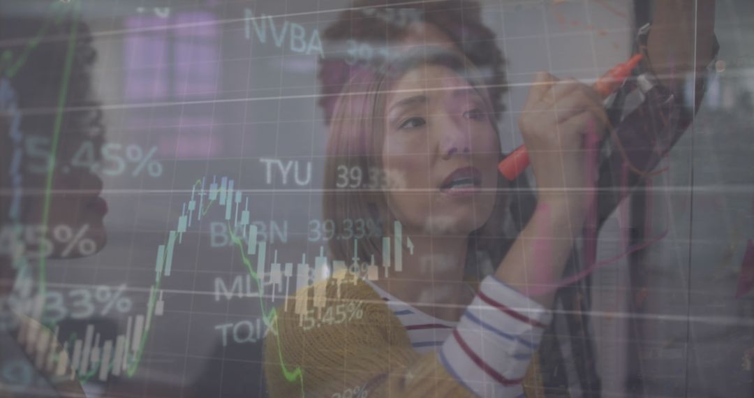 Business Team Analyzing Financial Data with Projected Charts