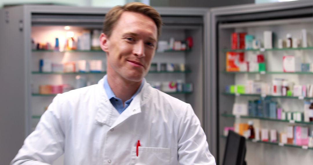 Smiling Pharmacist in White Coat at Pharmacy - Free Images, Stock Photos and Pictures on Pikwizard.com