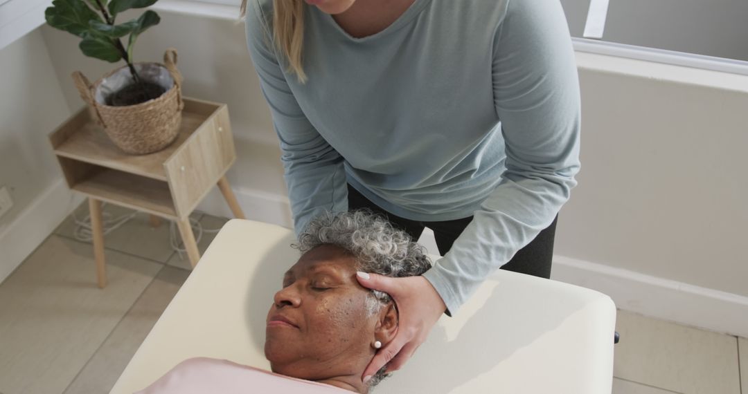 Female Chiropractor Treating Senior Woman with Manual Therapy - Free Images, Stock Photos and Pictures on Pikwizard.com