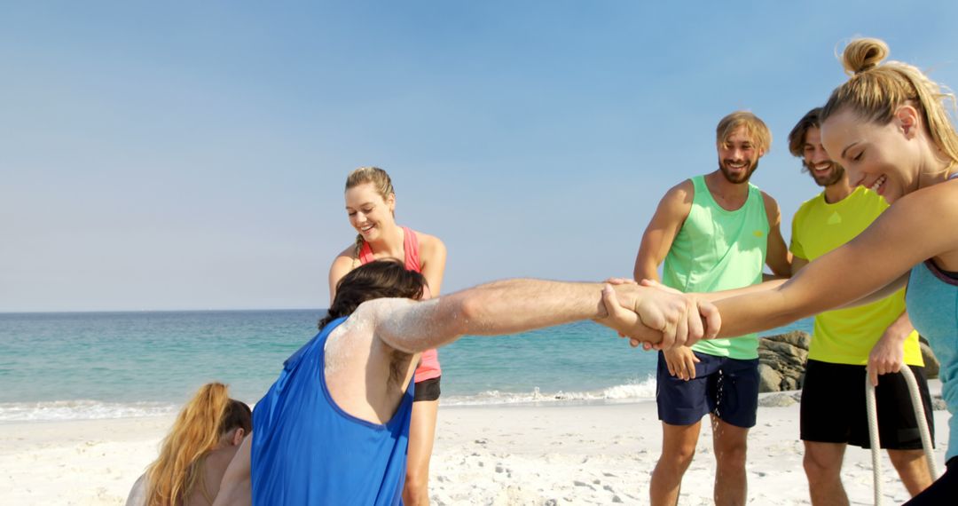 Friends Enjoying Summer Fun and Team Games on Sunny Beach Day