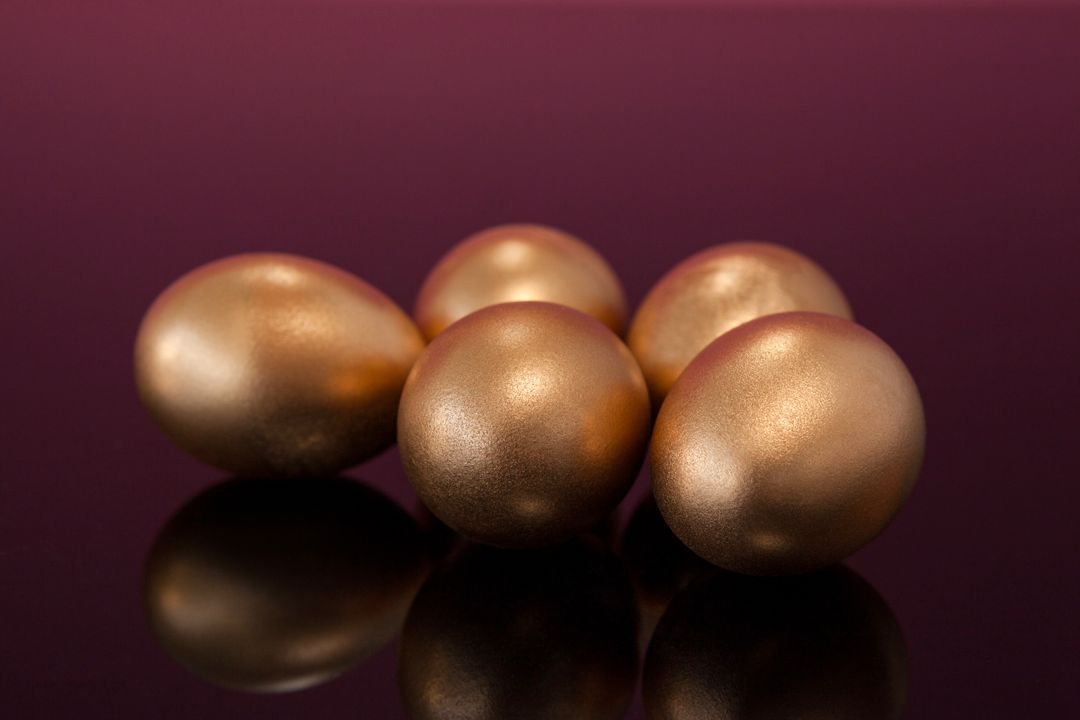 Close-up of Golden Easter Eggs on Colored Background - Free Images, Stock Photos and Pictures on Pikwizard.com