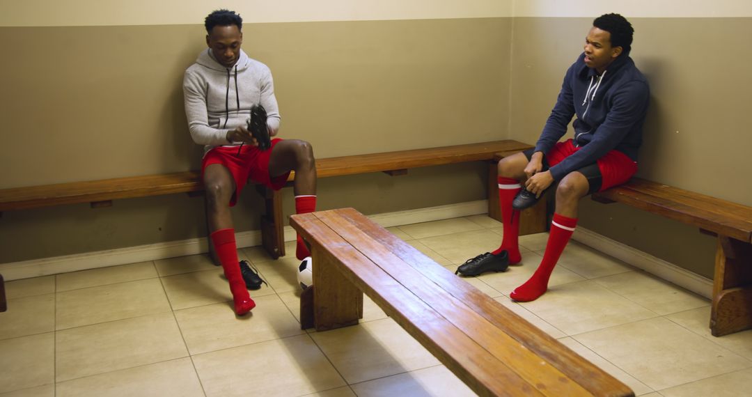 Teammates Preparing for Game in Soccer Changing Room